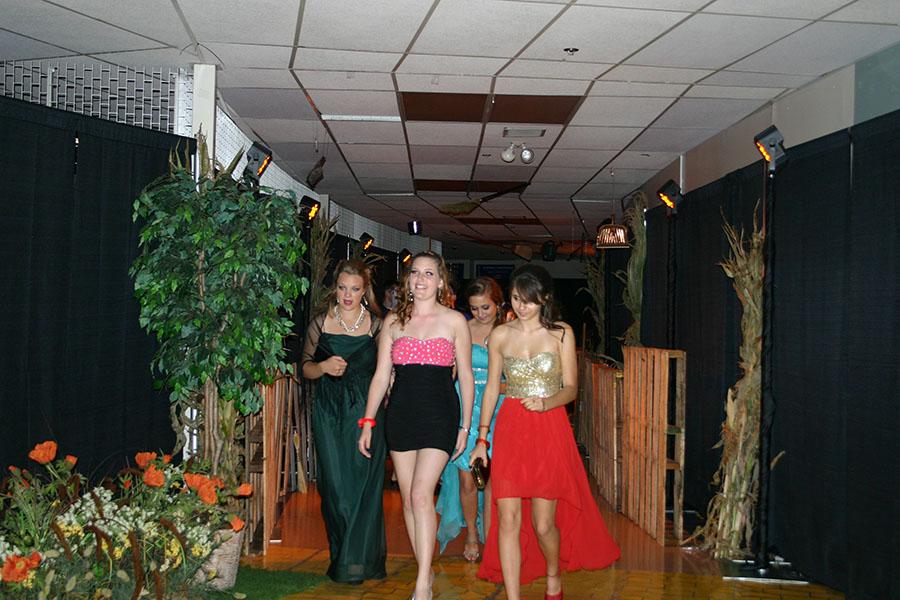 Sophomores Emily Wagner, Mamie Cornell, Sarah Schwark and Bella Ancevski walk into the Commons for their first homecoming dance. “While we were taking pictures before the dance I was really nervous and really excited because I didn’t know what to expect; but I knew whatever happened it was going to be great,” Wagner said. The homecoming dance attendees totaled over 1,500 students, the largest turnout in school history.
