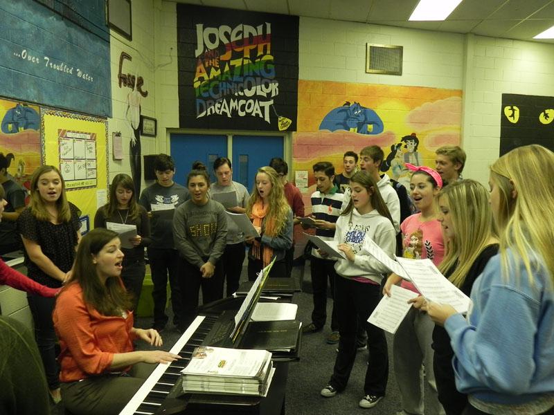 Choir members practice the song “Carol of the Bells” for their upcoming winter concert. “I think the choir will do wonderful,” senior Show Choir member Anna Agosta said. “There is a lot of true talent with everyone in our class.” The concert will take place on Dec. 11 and 12 at 7 p.m. in the Performing Arts Center.