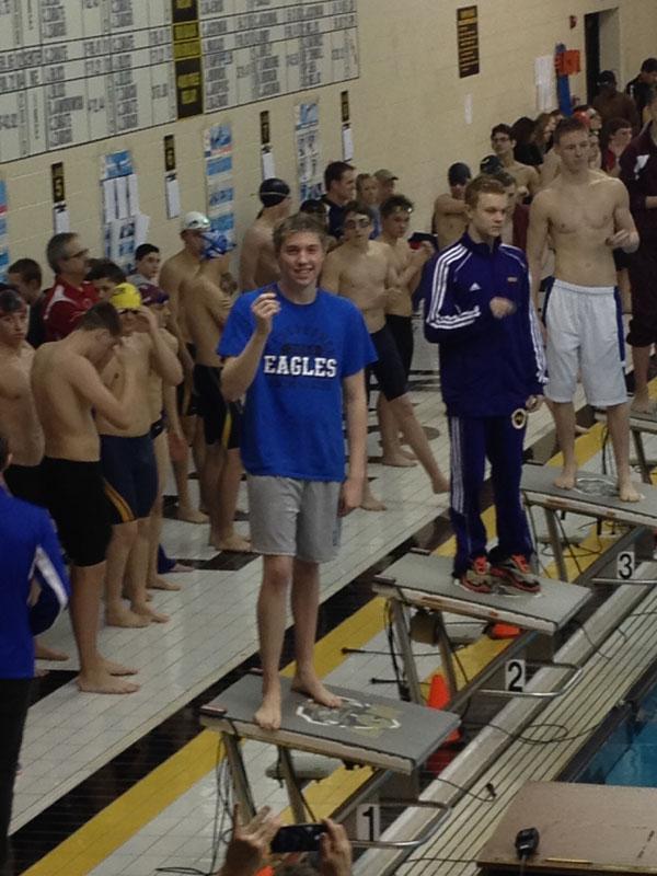 Senior+Varsity+Swimmer+Mike+Hudson+shows+off+his+first+place+medal+for+the+500+free+style+at+the+Men%E2%80%99s+Swim+and+Dive+Macomb+County+meet.+