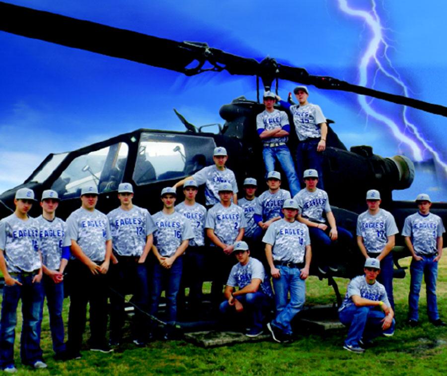 The Men’s Varsity Baseball team shows off their new camoflauge jerseys in front of a helicopter at Selfridge Air Base. “We felt it was a nice keepsake for the boys, putting their names on the back and allowing them to keep them after graduation,” Gendreau said. 
