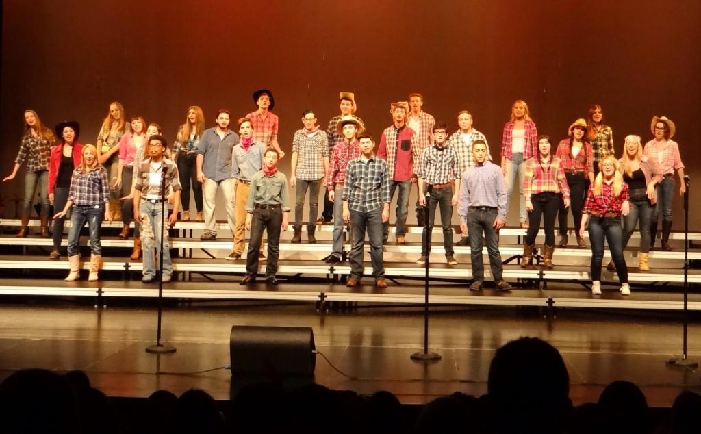 Performing during Monday nights show, the Show Choir takes the stage. It was fun hanging out with my Choir family in a country setting, junior Show Choir member Madison Mardney said.