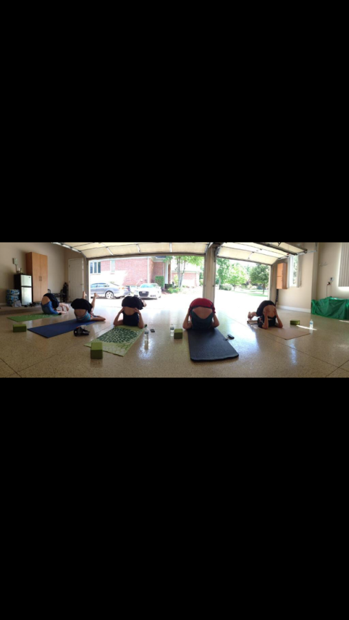 The yoga club in their first meeting practicing new poses.  I love how peaceful the yoga club makes me feel. junior Ally Hammond. 