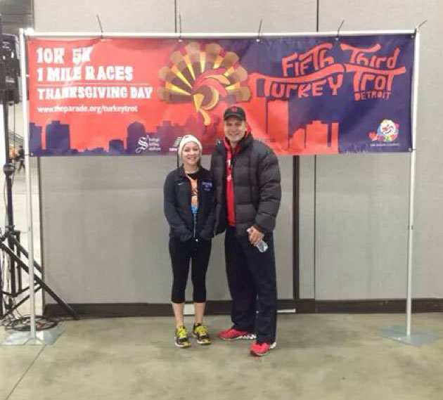 Junior Olivia Metty and her dad stood in Cobo Hall before the race began. Im always excited to do the Turkey Trot because me and my family go down there and meet other runners and watch the parade afterwards, Metty said. Metty and her family plan on  participating in future races.