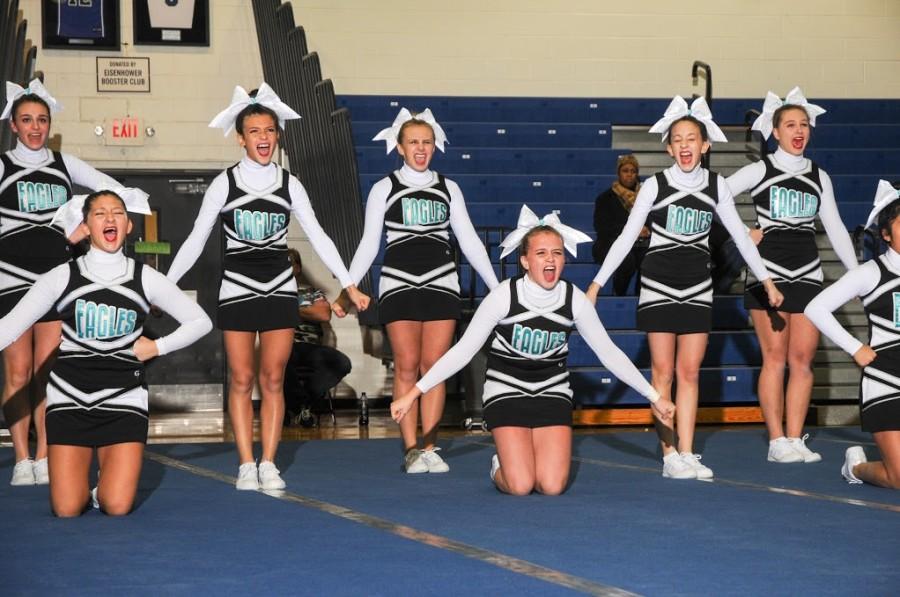 The JV team screams while doing their routine st a competition last year. “Competition was so fun last year,and i am so glad i made the team again this year so i can do it more,” JvV cheerleader junior Olivia Vizzacarro said. The girls have practiced just as well as last year and hope to do well in next weeks competition. 
