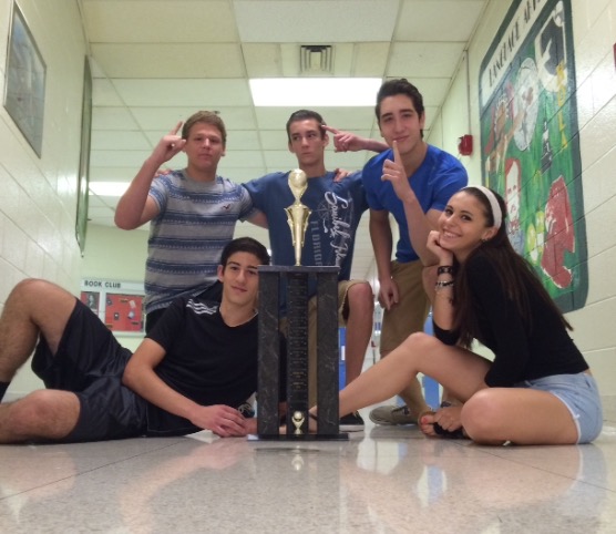 (from left to right) Last years Spanish team champions including junior Michael Bucholtz, sophomore Zach, junior Vincent Gacalone, Guiseppe Vitale and Bella Ancevski pose with the trophy. “I always get really excited for the end of the year soccer tournament; it’s something we can do before the stress of exam week,” junior Bella Ancevski said.
They said they plan on playing in the game next year and win back the trophy.