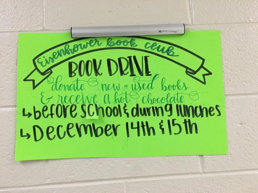 A poster is hung up in hallway to advertise the book donation.