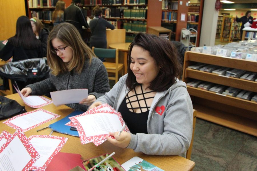 Sophomore Key Club member Kylee Zook sorts through letters to get them addressed and sent back to kids.