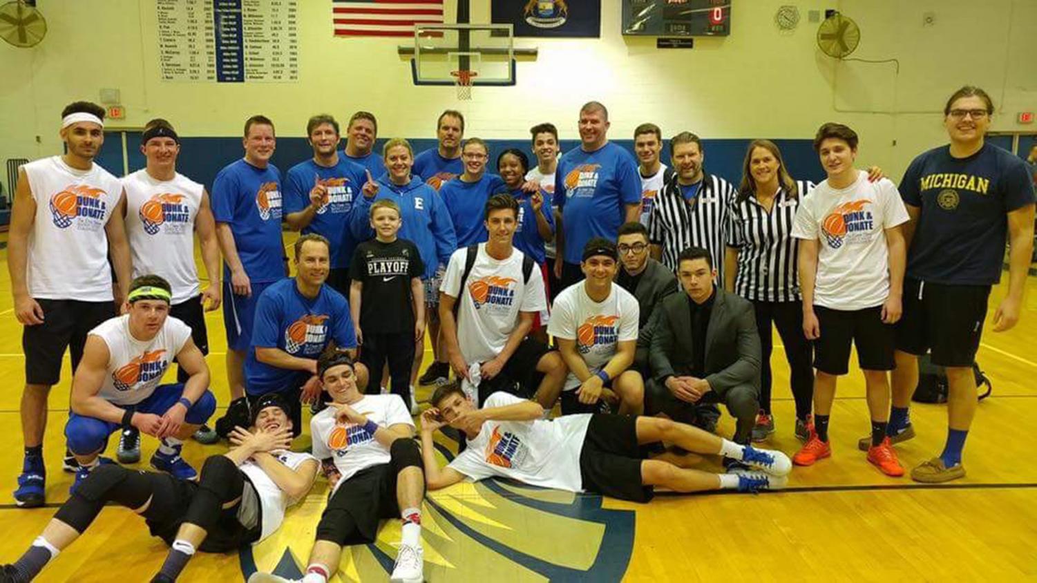 Players gather for a picture after last year’s charity basketball game where $3600 was raised. “For the staff who had Cassie, and our community, it’s important for us to feel like she’s still here,” Amber Bronson said.