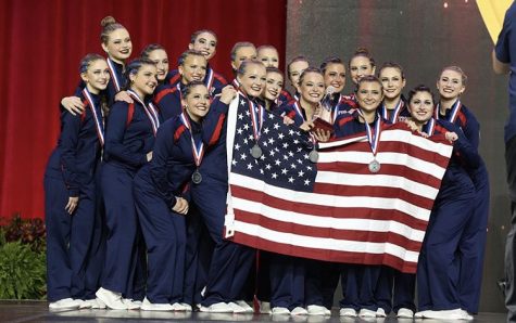 Representing the U.S. the varsity dance team display their silver medals for jazz. They are the first high school team in the history of America to compete at an international competition.