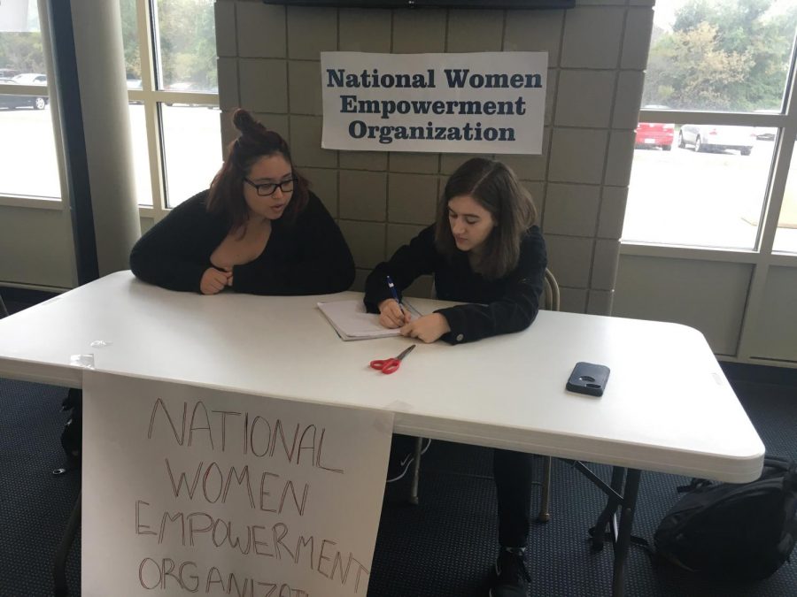 National Women Empowerment Organization President Kylee Zook and Vice President Amanda Davis plan what they are going to say at the club fair.