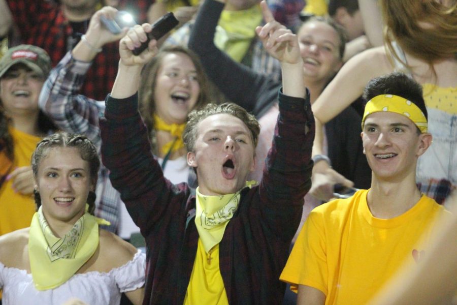 The student section cheers on their team.