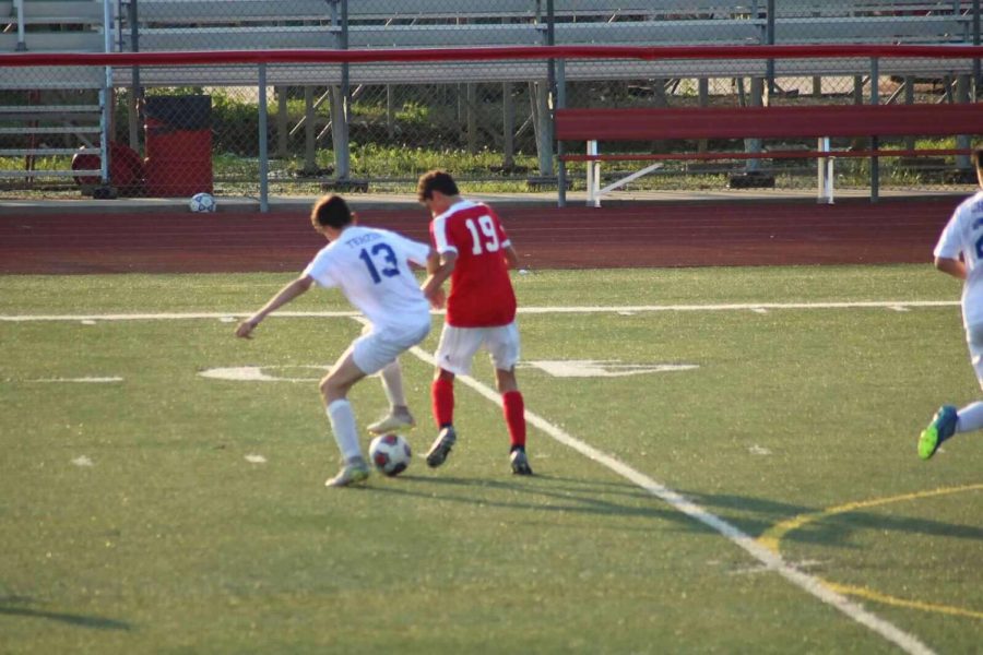 Sophomore Pietro Terzini steals the ball from opponent.