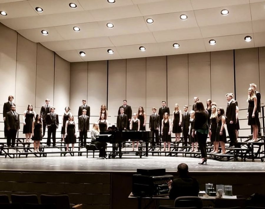 Show Choir on stage preforming at District Choral Festival.