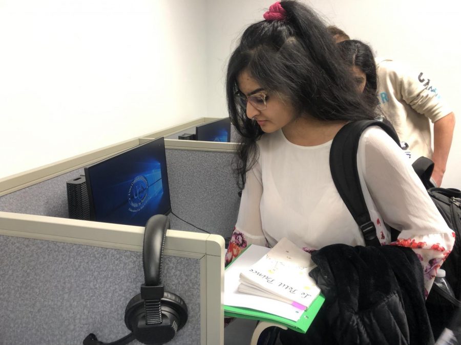 Shifting from her French homework, Junior Muanqa Imtiaz is seen as she leaves the language lab. “They’re [assignments] too hard,” Imtiaz said. Her and her classmates returned to the class to read Le Petit Prince