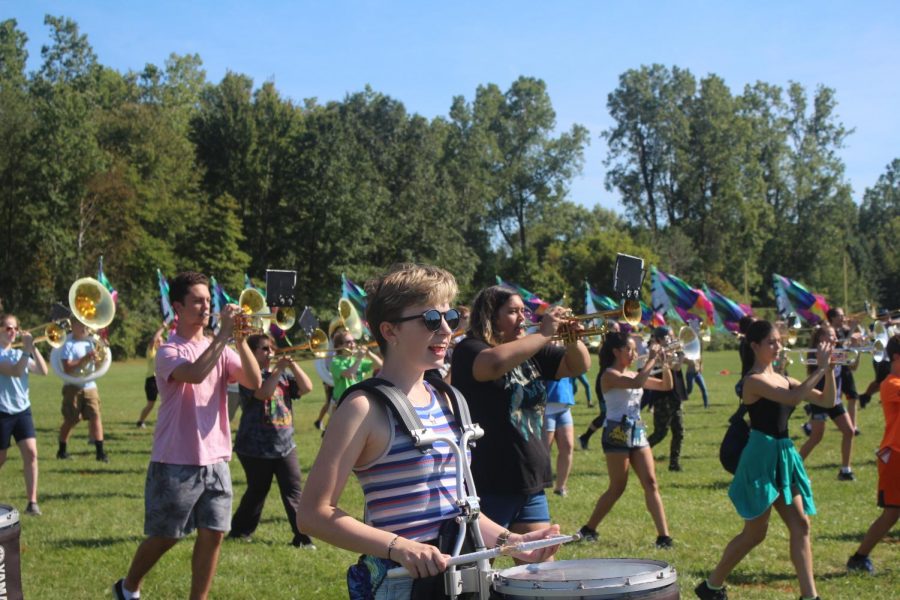 While in Marching Basics, junior drumline squad leader Erin Widman uses her vocals to call off step numbers for her fellow marchers. “I really care about the band and I want us to be as good as possible,” Widman said. In addition to regular rehearsals, Drumline occasionally held sectionals to help them improve.
