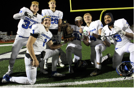 The team celebrates their District Championship win over Lake Orion on Friday, Nov. 8, 2019 sporting their traditional playoff bleached hair. “It’s something we do here every time we have playoffs and usually the whole team gets their hair bleached,” senior quarterback Blake Rastigue said.The bleached hair dates back to 1999, according to head coach Chris Smith.
Courtesy photo/ikefootball.net 
