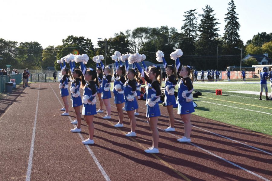 Calling a chant to the crowd, freshman cheerleaders fire up the football players and crowd at Swinehart Field. “In competitive season I’m looking forward to new challenges and new bonds with different people,” freshman Olivia Sugameli said. The freshmen are considered JV athletes for the competitive season.