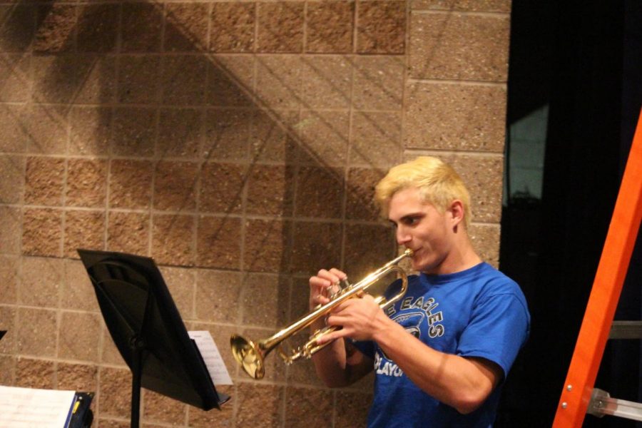As he practices with his brass trio, senior  trumpeter Micheal Gardini focuses on perfecting his part for Craft Castle. “[My favorite part] is being able to work together and make your own music,” Gardini said. Several types of chamber groups performed throughout the day in various areas in the school.  