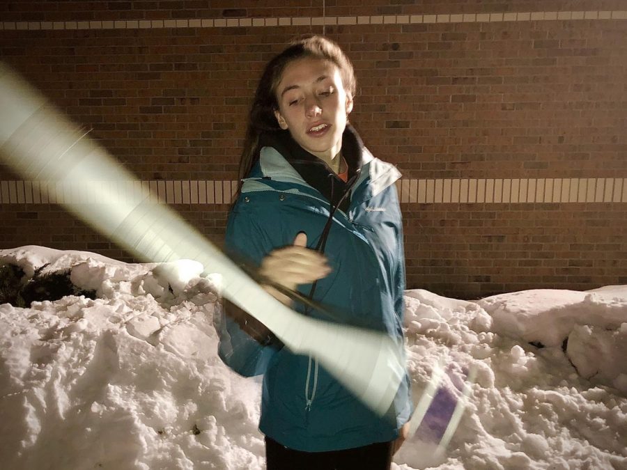 While everyone drives home from practice, sophomore Sofia Hemingway steps outside to practice spinning her rifle. “Although I jam my finger every time I spin a rifle, I still enjoy the experience,” Hemingway said. After she practiced for a few minutes, she went home to bed.