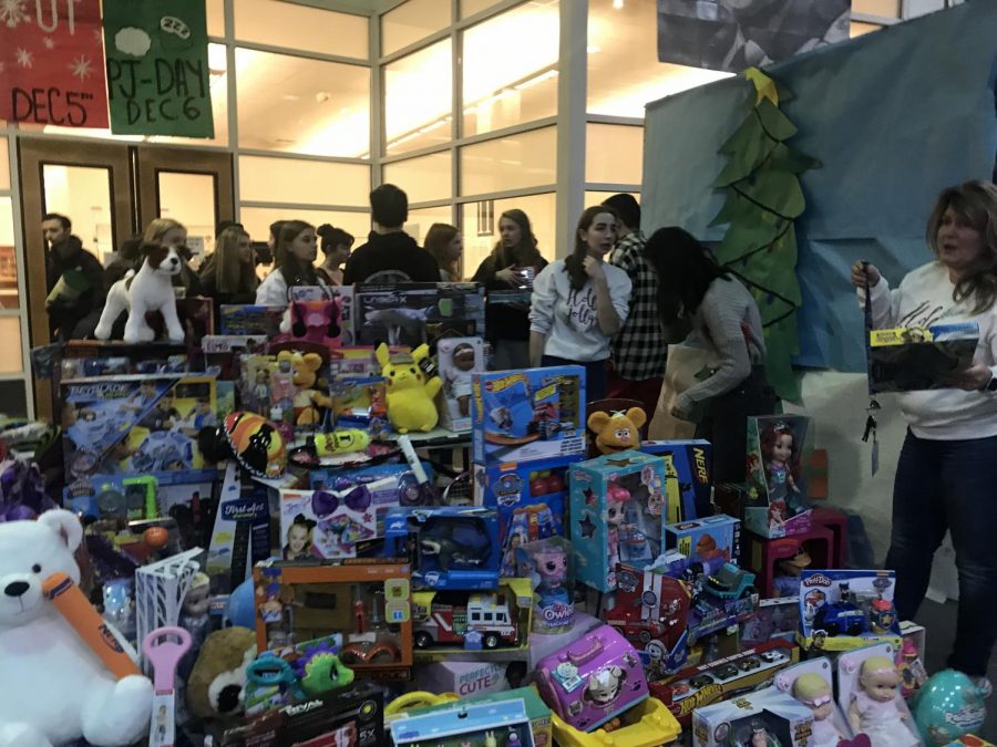 Student council members set up the toy results from the Toys for Tots drive for the Marines to pick up.