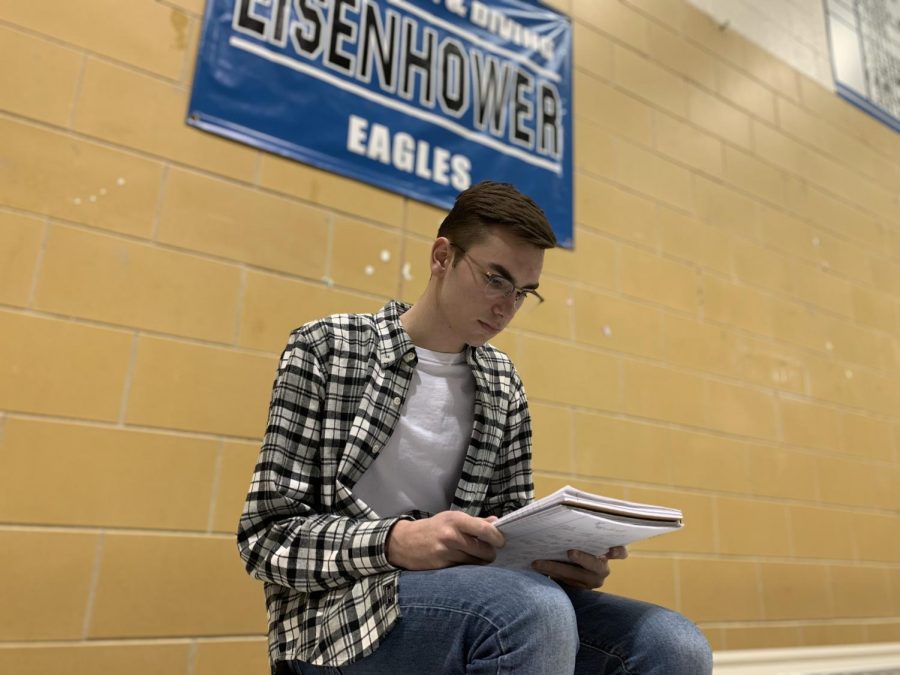 While studying with free time before practice, senior swimmer Michael Hagen makes sure he knows the material for his Wednesday exam. Michael practiced dryland exercises after studying with the meets being the week of exams. “Im excited to see how we do and how we can improve times,” Hagen said.