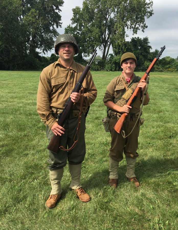 Participating+in+the+River+Raisin+Battlefield+Timeline+in+September+2018%2C+sophomore+Mitchell+Sturm+is+with+his+father+as+reenactors.+%E2%80%9CThat+was+a+very+fun+experience+with+my+dad%2C++because+we+were+both+doing+something+we+love+to+do%2C%E2%80%9D+Sturm+said.+The+weather+conditions+for+that+day+made+for+a+good+and+enjoyable+event%2C+according+to+Sturm.