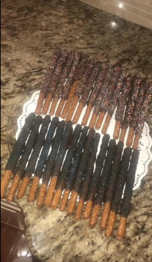 The pretzels finish their hardening after being drizzled with liquid chocolate. “The salt with the chocolate is my new favorite combination,” Sister Samantha Nowak said. The newly found recipe is being added to the family cookbook.