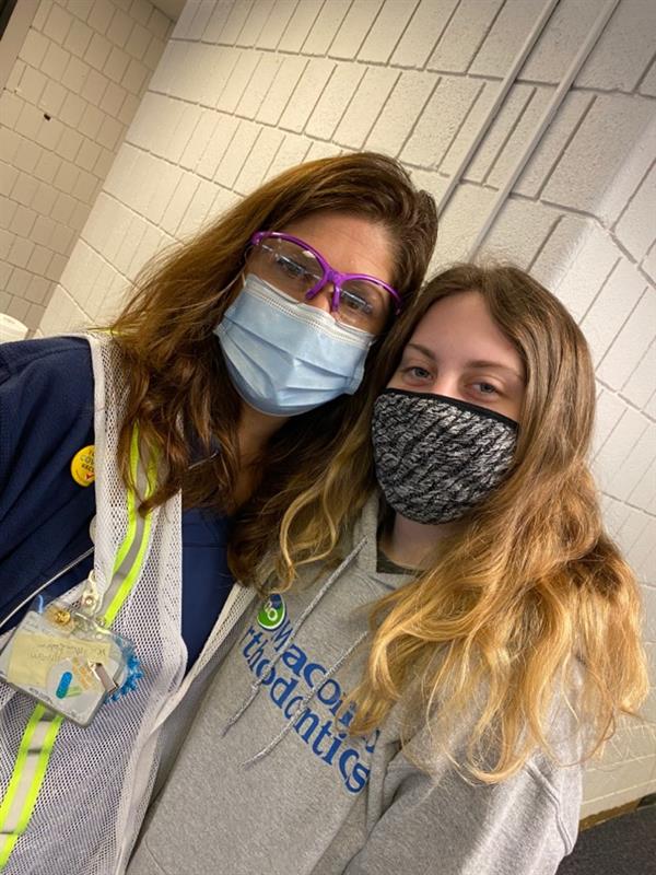 Right before this photo was taken, sophomore Rachael Gaulin got her first dose of the Pfizer vaccine. I was really happy my aunt was able to give me my first shot because I felt a lot less nervous, Gaulin said. Gaulin will be getting her second dose soon.