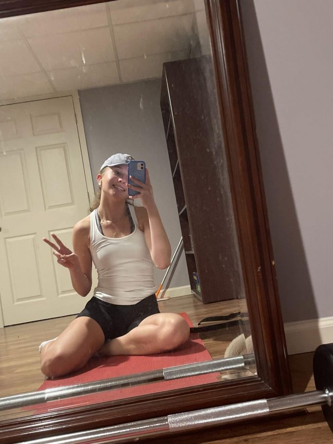 Posing+for+a+mirror+selfie%2C+senior+Alexandra+Gjokaj+finishes+her+workout+at+PowerHouse+Gym.+%E2%80%9CI+go+to+the+gym+because+it+helps+me+to+feel+healthier+and+more+active%2C+especially+during+the+winter+time%2C%E2%80%9D+Gjokaj+said.+Gjokaj+continued+to+go+to+the+gym+at+least+three+times+a+week+to+stay+in+shape.+