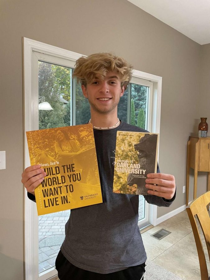 Smiling for a picture, Senior Brenner Smith holds up his acceptance letters. “I’m still unsure where I want to go, but I’m excited for my college journey.” Smith is looking at all of his options for his education and will be deciding soon.