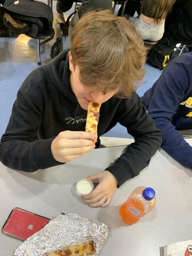 Trying to finish, senior Masen Leykauf eats fast to be back to class on time. “Longer lunches would benefit me so I can eat all my food in the period of time I have and can help me get some leftover homework done”. Other students dealt with this problem as they had to rush to eat.
