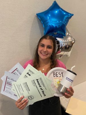 After an award winning year, sophomore Daniella Danko collects her awards at the publications banquet. This was Dankos first year on the newspaper staff, and she won a total of five awards. “I was super proud and just excited that all my hard work was able to be recognized.”  
