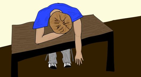  A student putting their head down on a school desk, tired and frustrated from a lack of sleep the night before. 