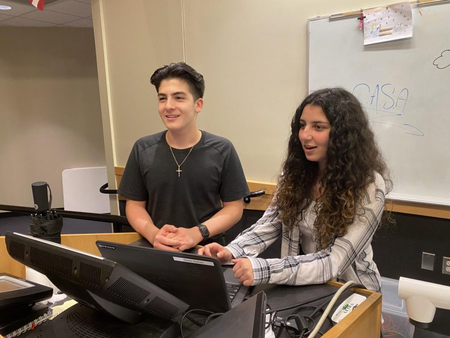 As a way to begin C.A.S.A’s (Chaldean American Student Association) practice meeting to head start the 2022-2023 school year, President and Vice president, sophomores Mekhi Kattula (left) and Angelina Elias (right) present a powerpoint which explains what the club is and what future activities will be held as an introduction for all members. “I personally like CASA because it involves my culture into an area that hasn’t been as diverse,” member and sophomore Alvero Kryakoos said. “It’s kind of expanding.”