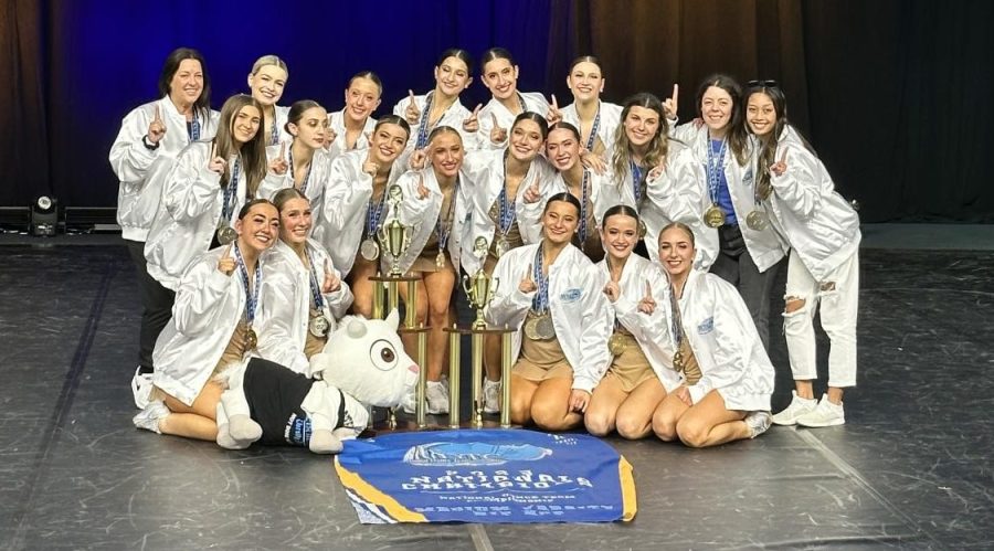 Courtesy+photo+and+caption++Alexis+Urbano%0AHand+in+hand+with+their+1st+place+gold+trophy%2C+the+varsity+dance+team+celebrate+their+title+as+the+national+champions.+The+team+worked+throughout+the+entire+season+on+their+routine+and+their+hard+work+paid+off.+%E2%80%9CIt%E2%80%99s+bittersweet+and+I+feel+very+sad+that+it+is+over%2C%E2%80%9D+senior+varsity+captain+Jordan+Temple+said.+%E2%80%9CBut+I+am+very+happy+it+happened%2C+it+was+definitely+very+nice+to+go+out+on+a+win.%E2%80%9D
