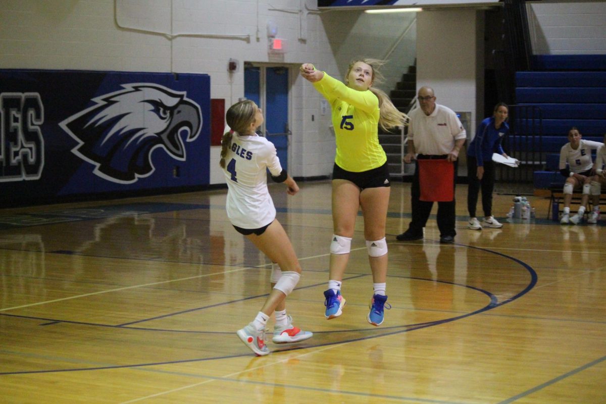 MINE%21+Prepared+for+impact%2C+sophomore+varsity+volleyball+player+and+libero+Kayla+Ostrander+%5Bpictured+on+the+right%5D+has+her+arms+out+in+a+bump+position+ready+to+receive.+Ostrander+and+her+teammates+lost+their+home+game+against+Marysville+high+school.+%E2%80%9CShe%E2%80%99s+always+next+to+me+on+the+court+when+I+need+her+for+support%2C%E2%80%9D+sophomore+varsity+volleyball+player+Gina+Fedrigo+said.