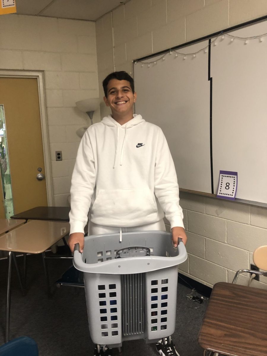 Laundry day! On Thursday Sept. 21, sophomore Issa Dababneh participates in “anything but a backpack” spirit day with his laundry basket. Dababneh decided to bring a basket because he wanted to join in on school spirit. “The event was really fun, to be honest, because I got to hang out with other friends who contributed,” said Dababneh.

