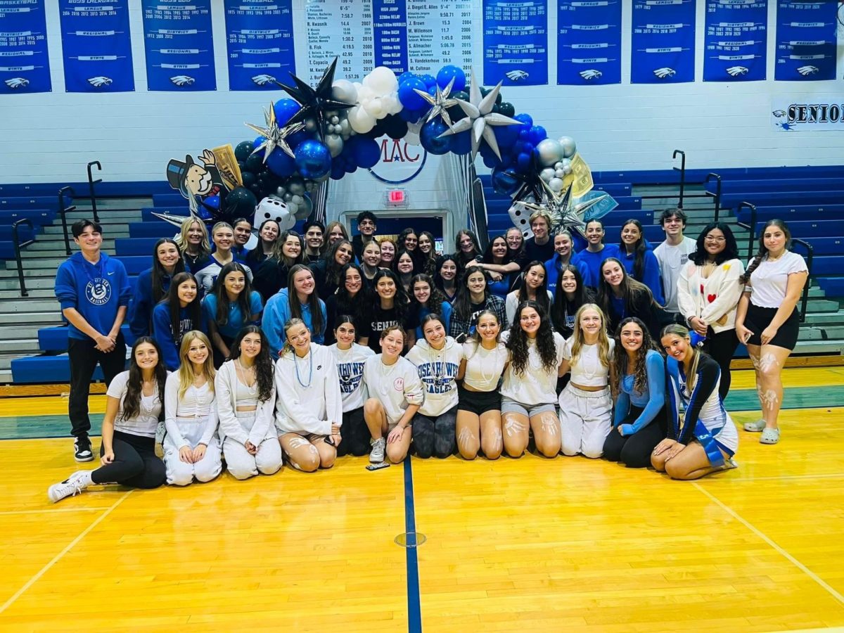 Behind the scenes. Student council poses for a group photo after preparing for the homecoming pep rally. Summer preparations and bi-weekly meetings brought the board game themed homecoming week together. 