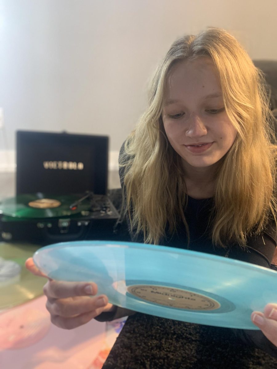 The tables are turning. Listening to “Evermore” by Taylor Swift, junior Elmarisa Hayden admires her friends’ vinyl collection. Vinyl sales have skyrocketed with a revenue of $1.2 billion in 2022.