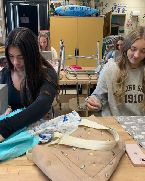 Sewing is caring. Junior Shelby Mcneil and senior Abby Nezich use the sewing machines to make pillowcases. Members picked out fabrics of their choice and donated the pillowcases towards Children’s Hospitals. It was really rewarding donating to the children; it made me feel good,” Mcneil said.
