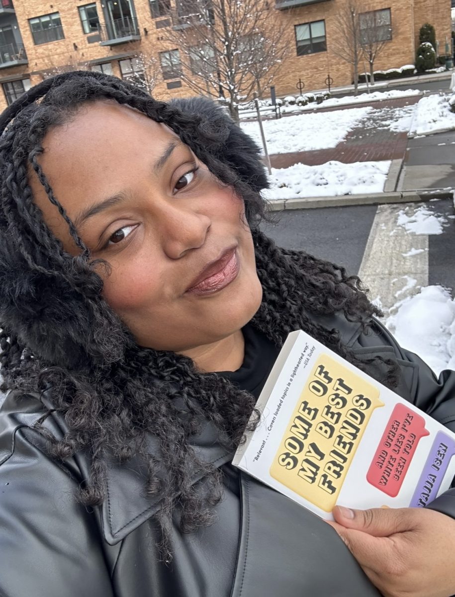 On the streets of New York City alumna Aleaha Smith holds up one of Atrias newest books, Some of My Best Friends. Atria published the book Tuesday, February 27. 