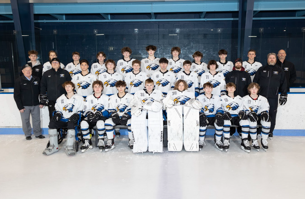 The+Varsity+hockey+team+takes+their+team+photo.+As+their+season+comes+to+an+end+David+Erwin+transitions+over+as+the+head+coach.