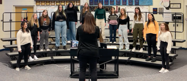 Harmony highs. Rehearsing their songs for the Michigan School Vocal Music Association All-State-Festival, the Women’s Chorus Blue Ensemble perform for choir teacher Julia Holt. To make it to the festival, ensemble members previously competed in the state solo and ensemble festival. “It (rehearsals) can be stressful but in the best way because we’re all learning songs that we know we’re going to sound great for in the end. And we all work really hard to get where we are,” junior ensemble member Raegan McCloud said.
