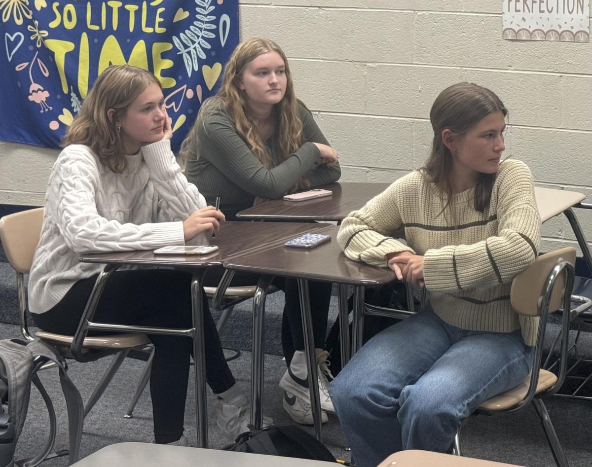 During the first book club meeting members listen as everyone introduces themselves and shares why they joined the club. After introductions, members chose the club's first read for October. 
