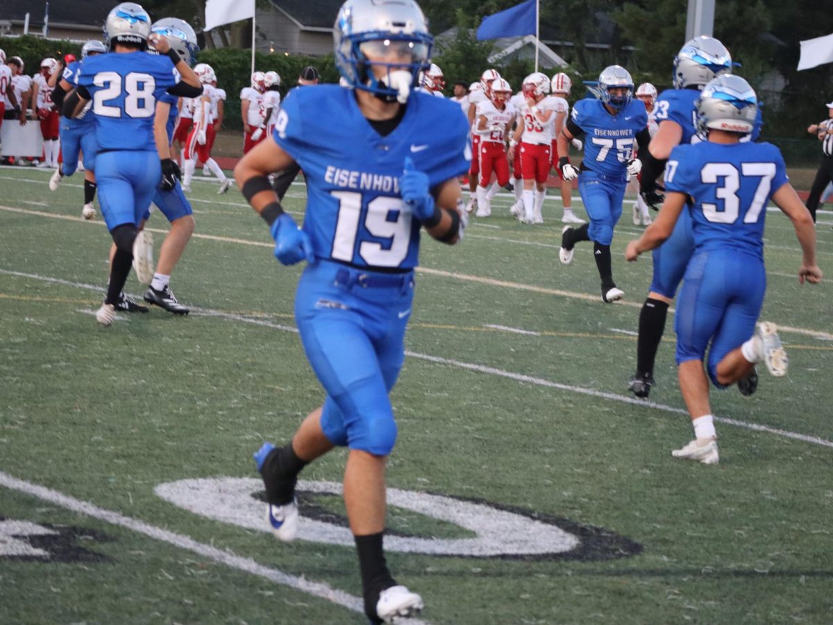 Playing during the last homecoming game, senior Griffin DeMasse plays on the Swinehart Field. The crowd cheered wildly, motivating the team. “I like the environment, it shows that this game is a big deal,” DeMasse said.
