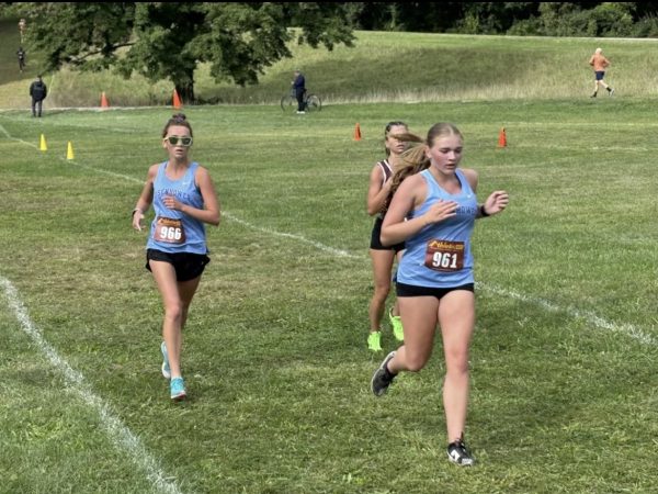 At the Averill Invitational held at Kensington Metro Park,
sophomore Greer Nimmo runs her last 100 meters before the
finish line. "It was a hard course, but it felt better this year than
when I ran it last year," Nimmo said.