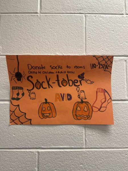 Posters hang around the school to promote Socktober. Students dropped socks in boxes in front of teachers’ rooms to donate for the cause. 