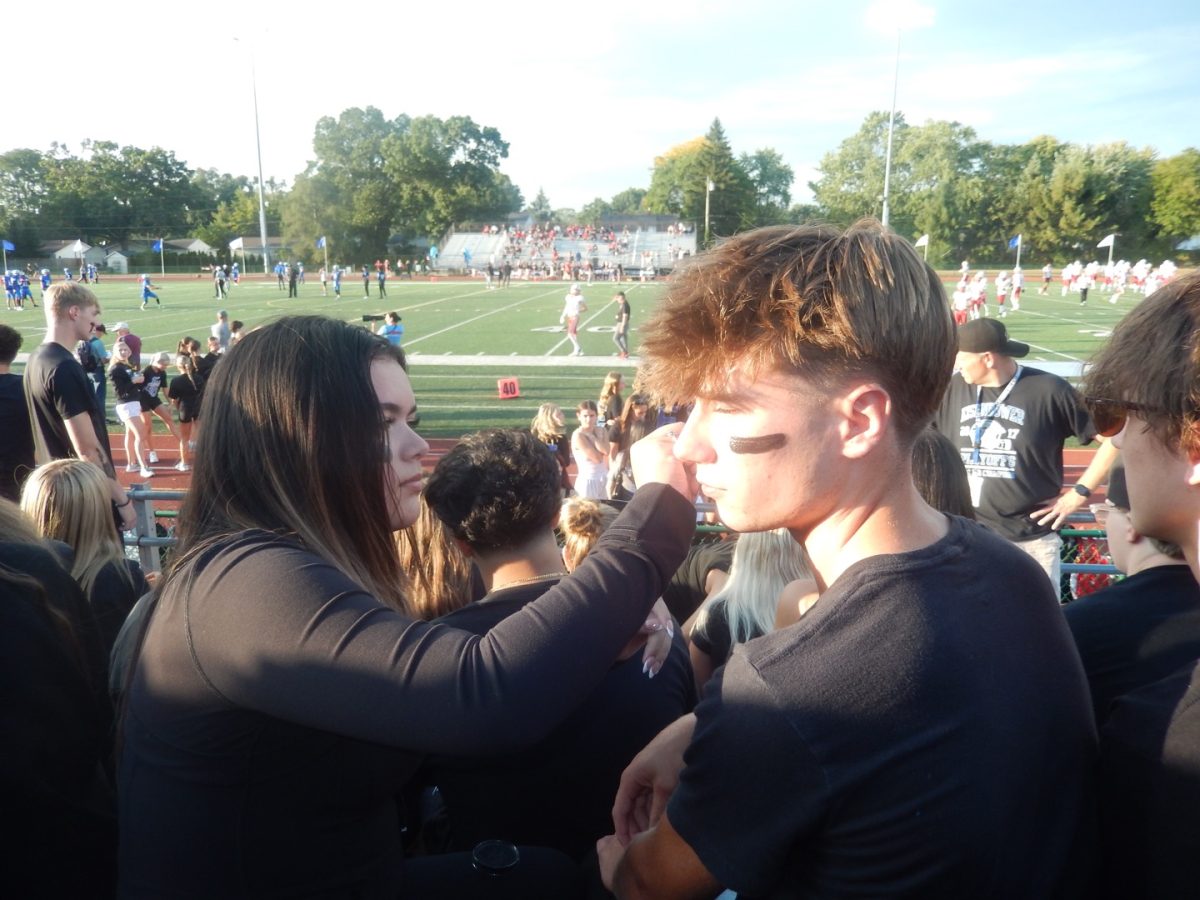  Before the pep assembly seniors Sofia Lux Hernandez and Joshua Banbridge applied face paint on one another. The theme being black out and the tensions being high influenced an electric atmosphere.“It was very fun and the theme brought everybody together” Hernanzez said.