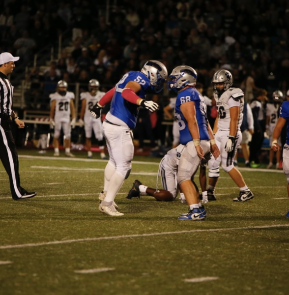 Senior defensive lineman Michael Dziadula is celebrating with junior defensive lineman Marco Fodale after a big play against Dakota. The Eagles went on to win this game 21-14 on October 11th to split the MAC red title.