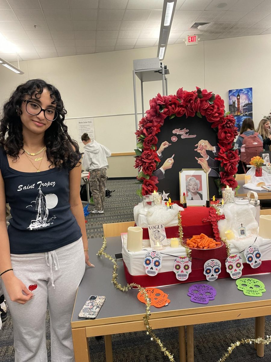 Making an Ofrenda this past Monday, Nov. 4, junior Atalya Ballow utilizes items she used the year prior when making an Elvis Ofrenda. This year, her Ofrenda was in honor of Hollywood celebrity Marilyn Monroe.